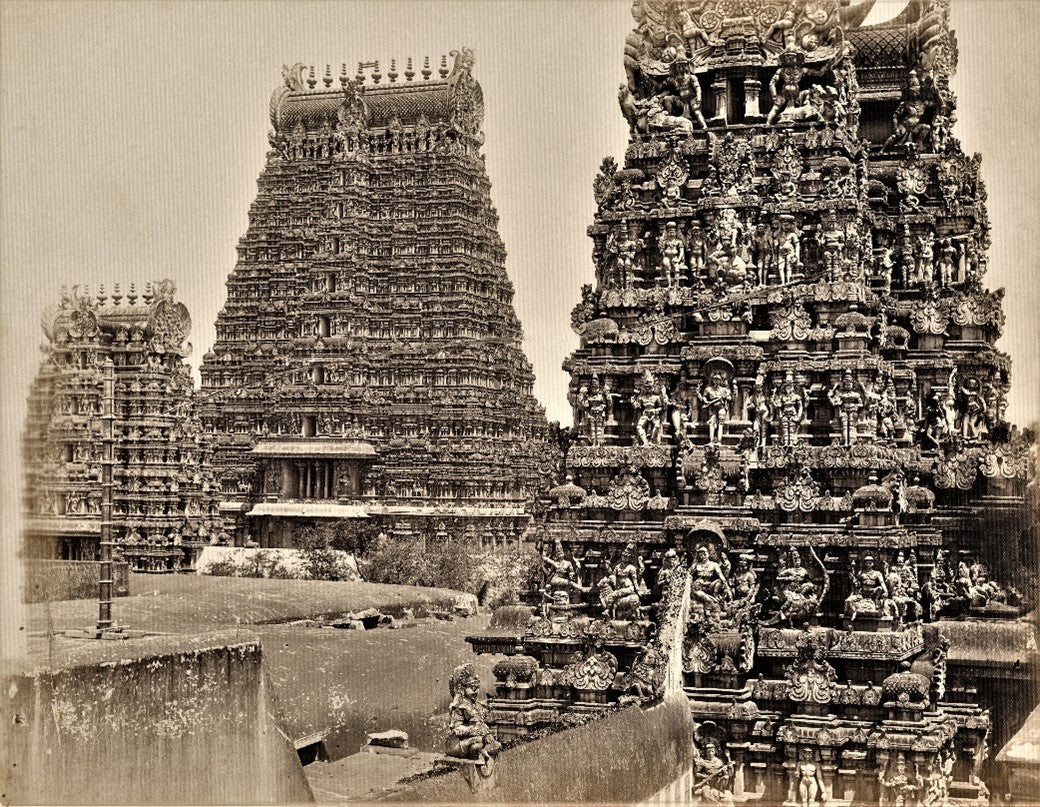 Sepia-toned 19th-century photograph of the Meenakshi Amman Temple in Madurai, featuring intricately carved Dravidian gopurams (gateway towers)