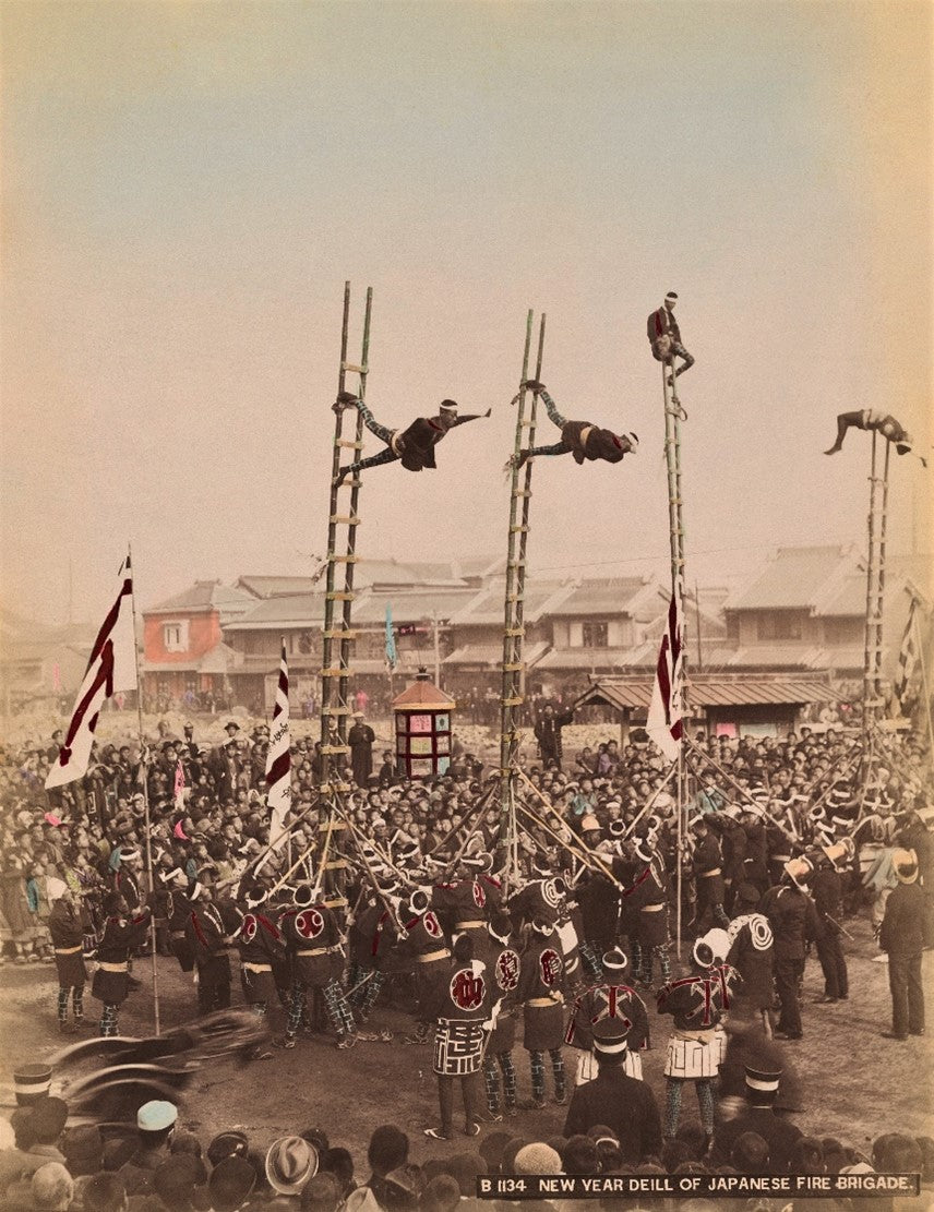 Japanese fire brigade performing ladder drills during New Year festival, Meiji-era photo by Kusakabe Kimbei