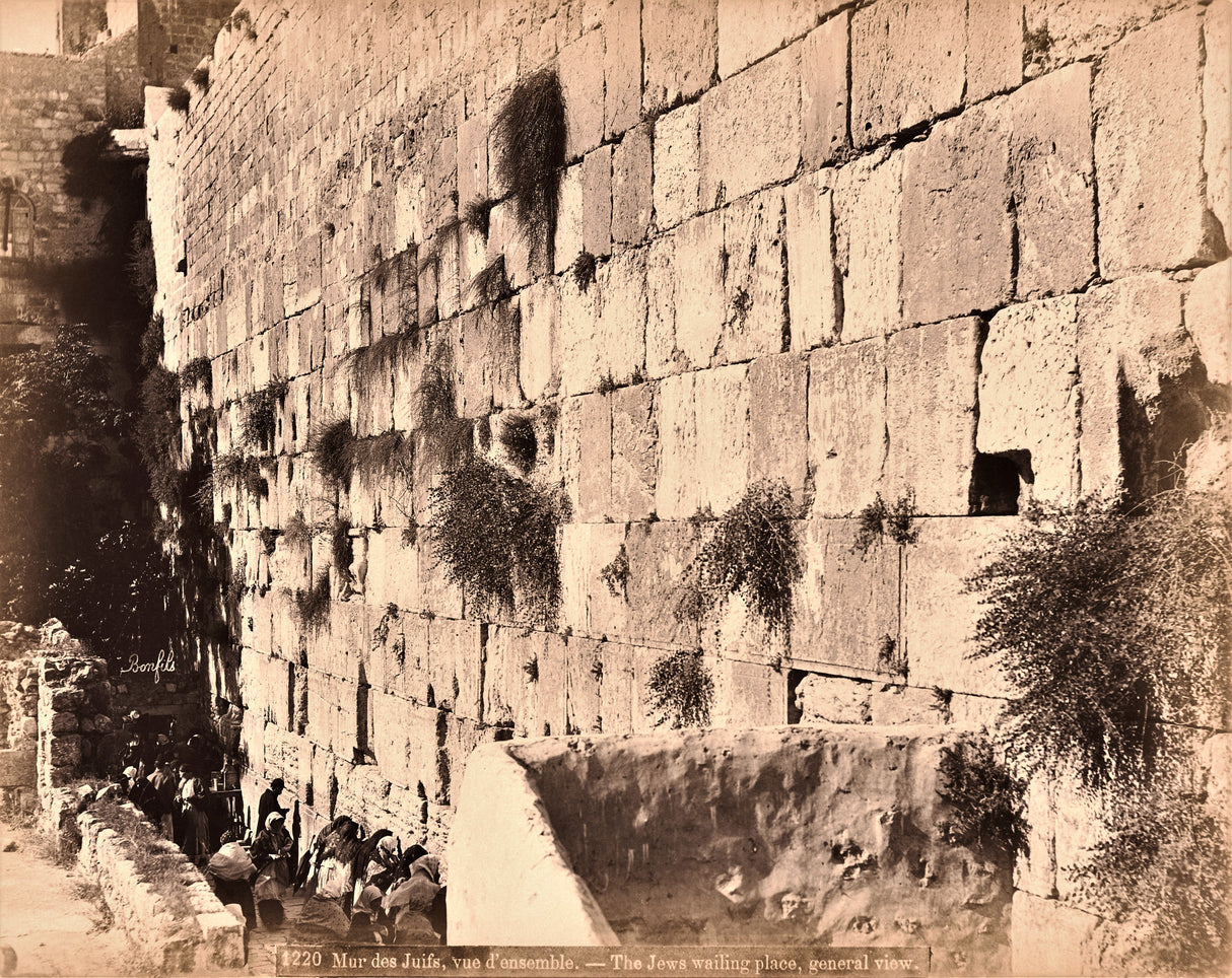 “Historic 1875 photograph of the Western Wall in Jerusalem by Félix Bonfils, with Jewish worshipers in prayer.”