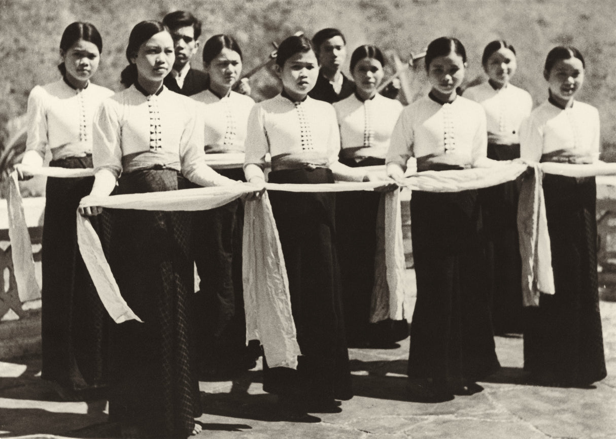 Black-and-white photo of young White Thai women holding scarves in a traditional dance formation, Vietnam