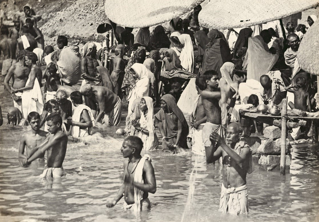 Devotees bathing in the Ganges River during a religious ceremony in Varanasi, late 19th century