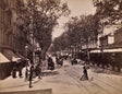 Sepia photograph of Avenue de la Gare in Nice with pedestrians and horse-drawn carriages, circa 1890