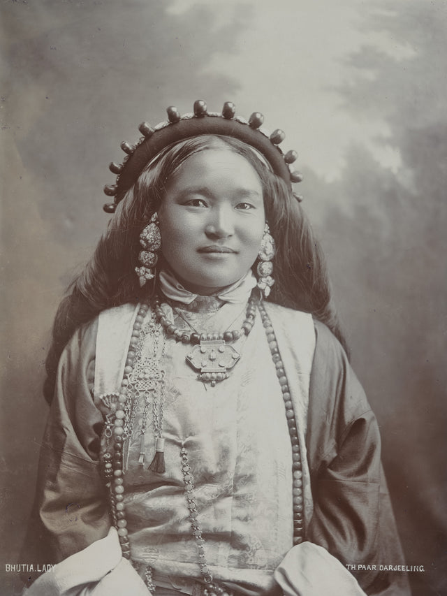1890s studio portrait of a Bhutia woman in Darjeeling wearing traditional dress and jewelry