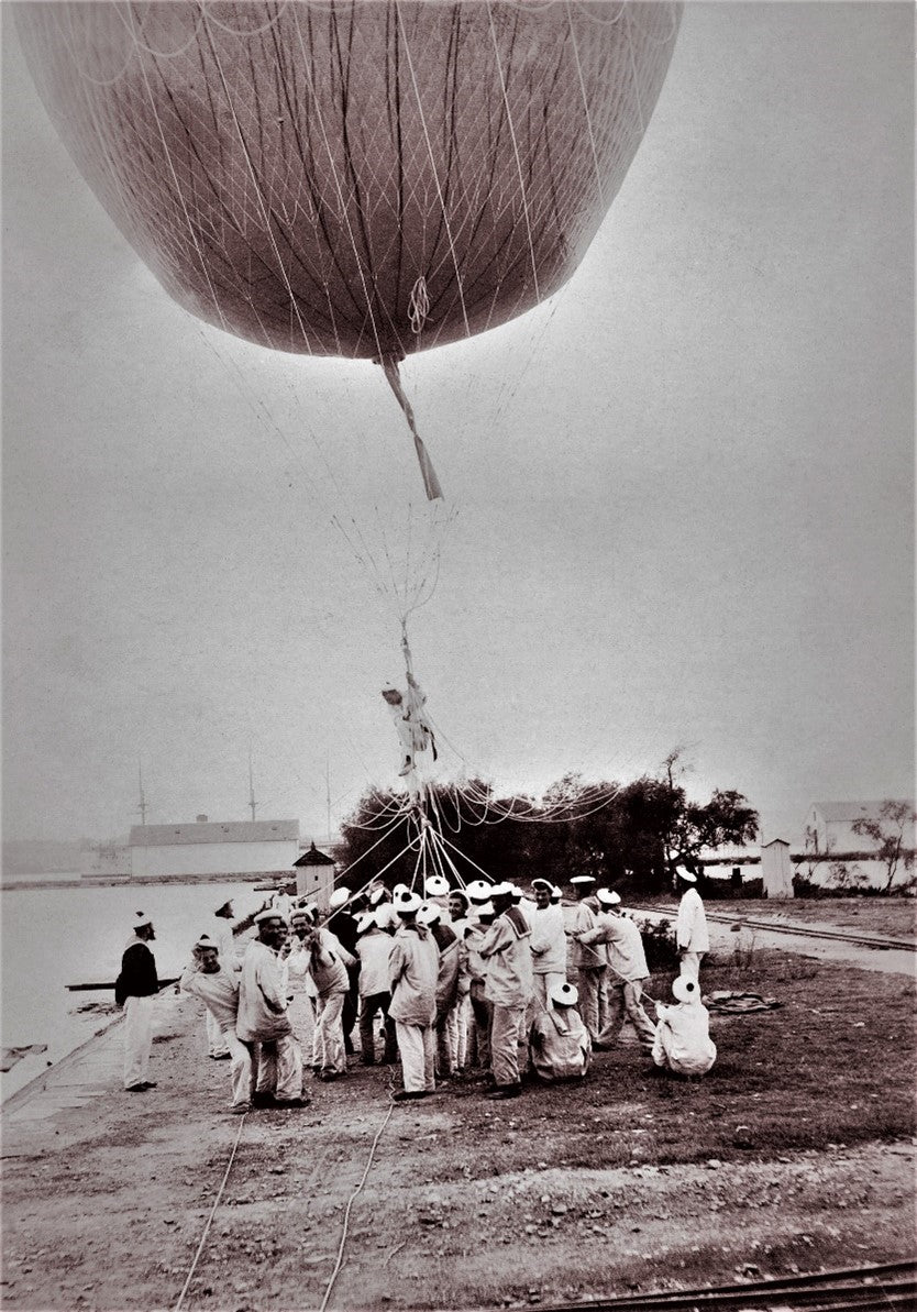 Black and white photo of naval balloon launch with sailors in uniform, late 19th century