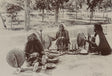 Sepia photo of Indian women using spinning wheels to prepare yarn, 1890s

