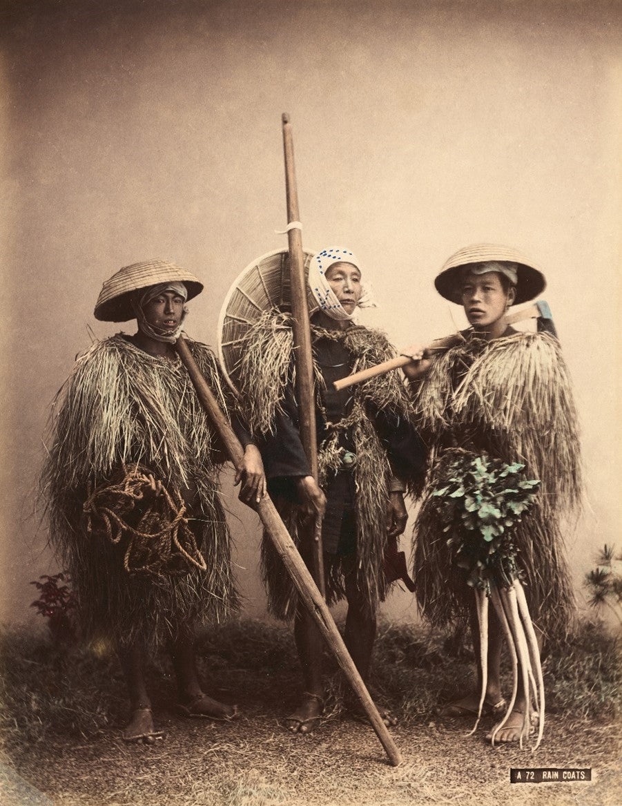 Three Japanese rural workers wearing straw mino and kasa in hand-colored 19th-century photograph